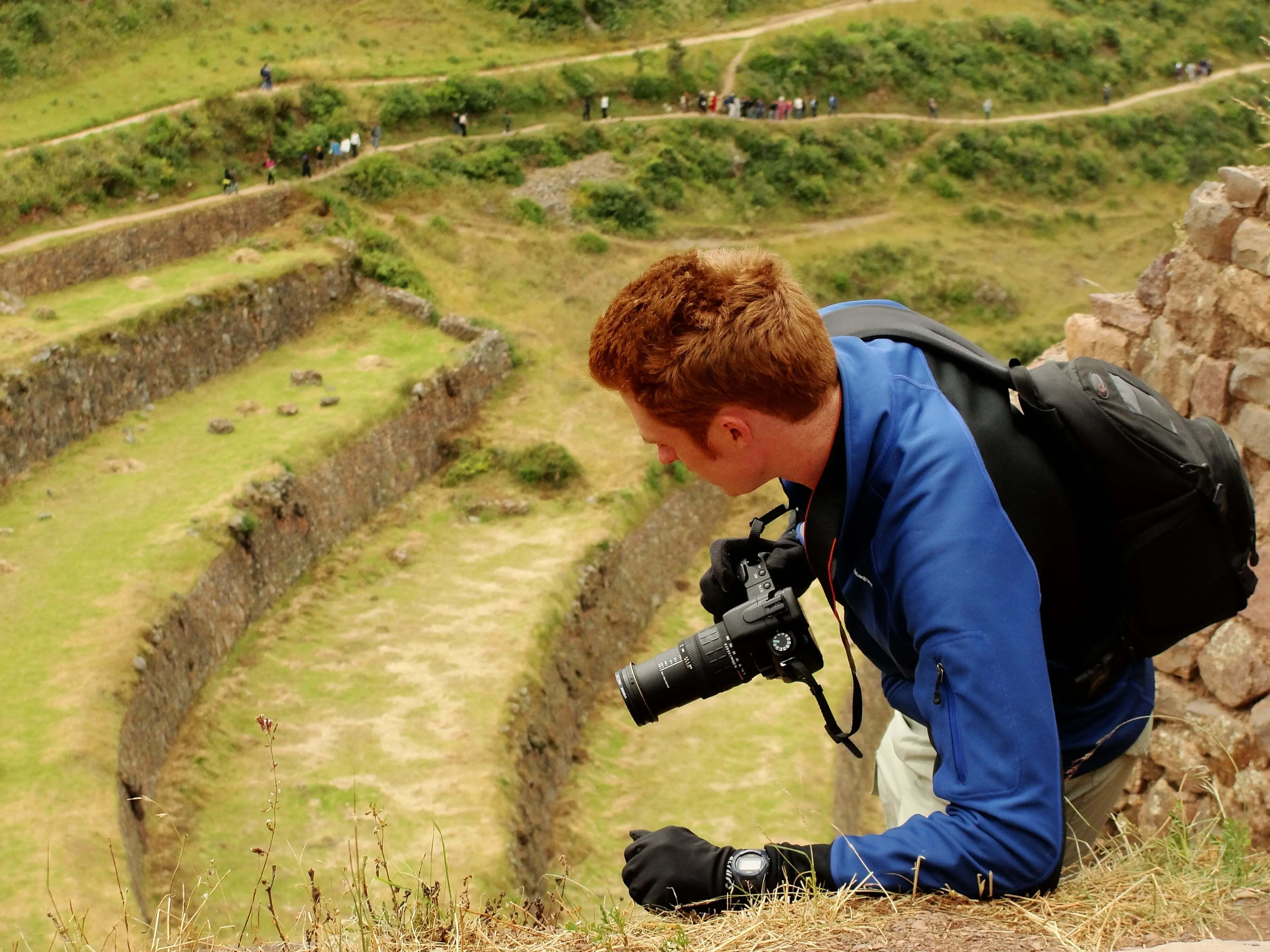 Nomadic Samuel traveling in Peru with a camera in hand