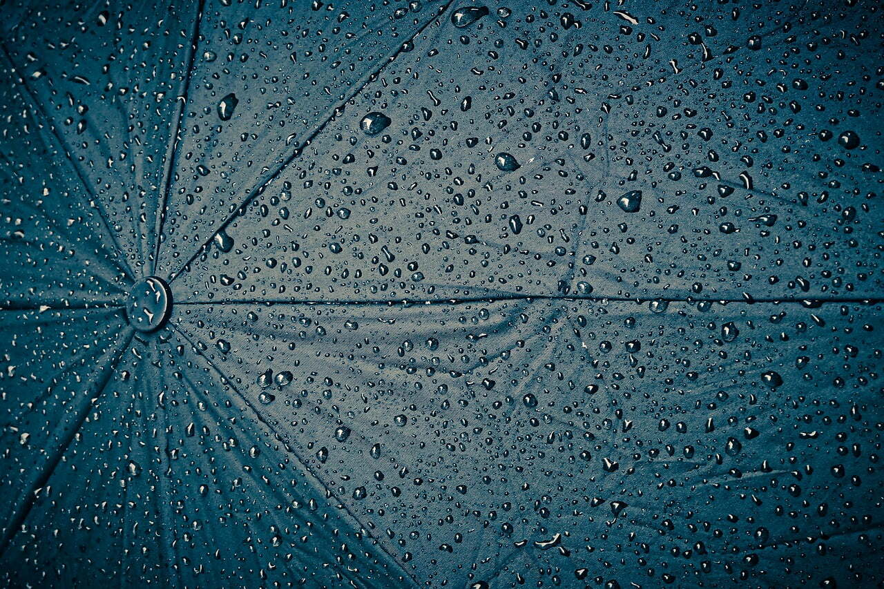 Umbrella with rain drops on it