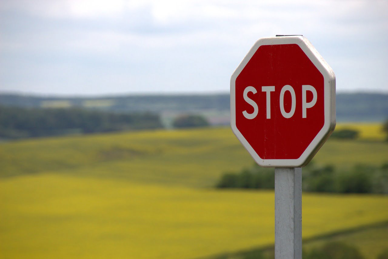 Stop sign overlooking the field 