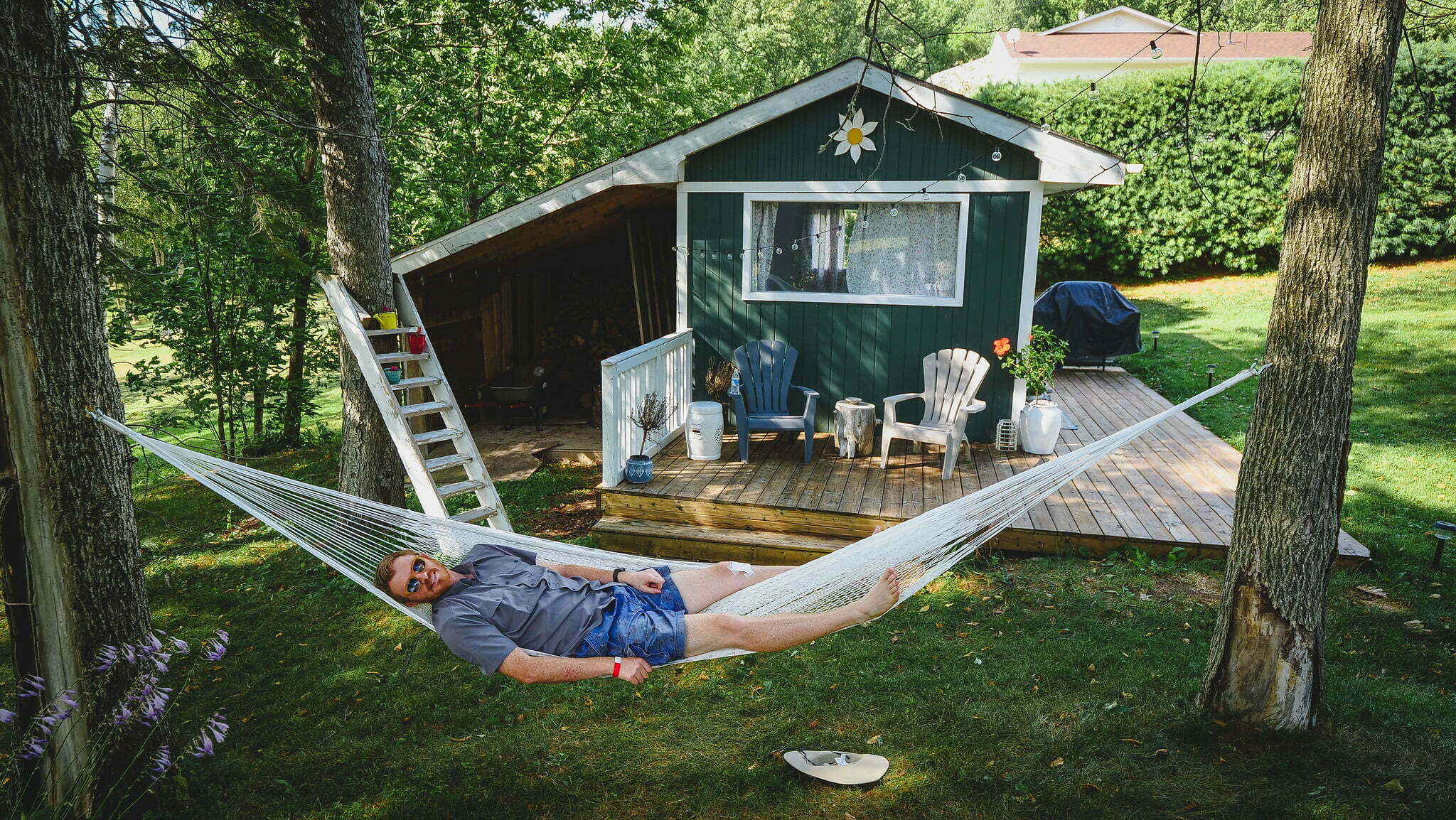 Nomadic Samuel chilling out in New Brunswick, Canada while visiting a tiny house for a weekend getaway