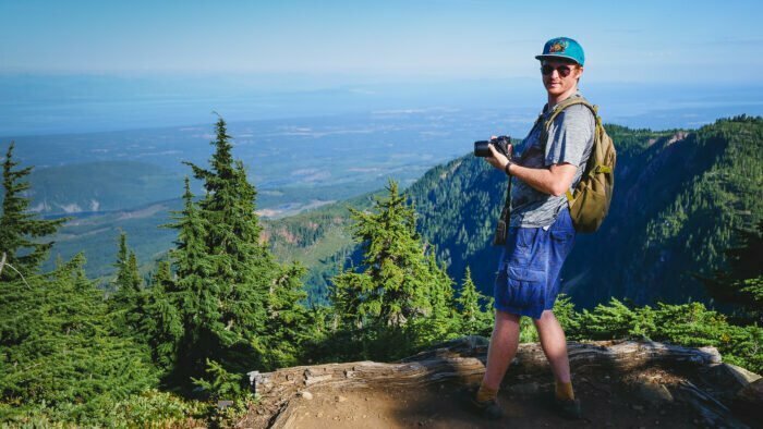 Nomadic Samuel admiring the views of Mount Washington while visiting Vancouver Island, British Columbia, Canada