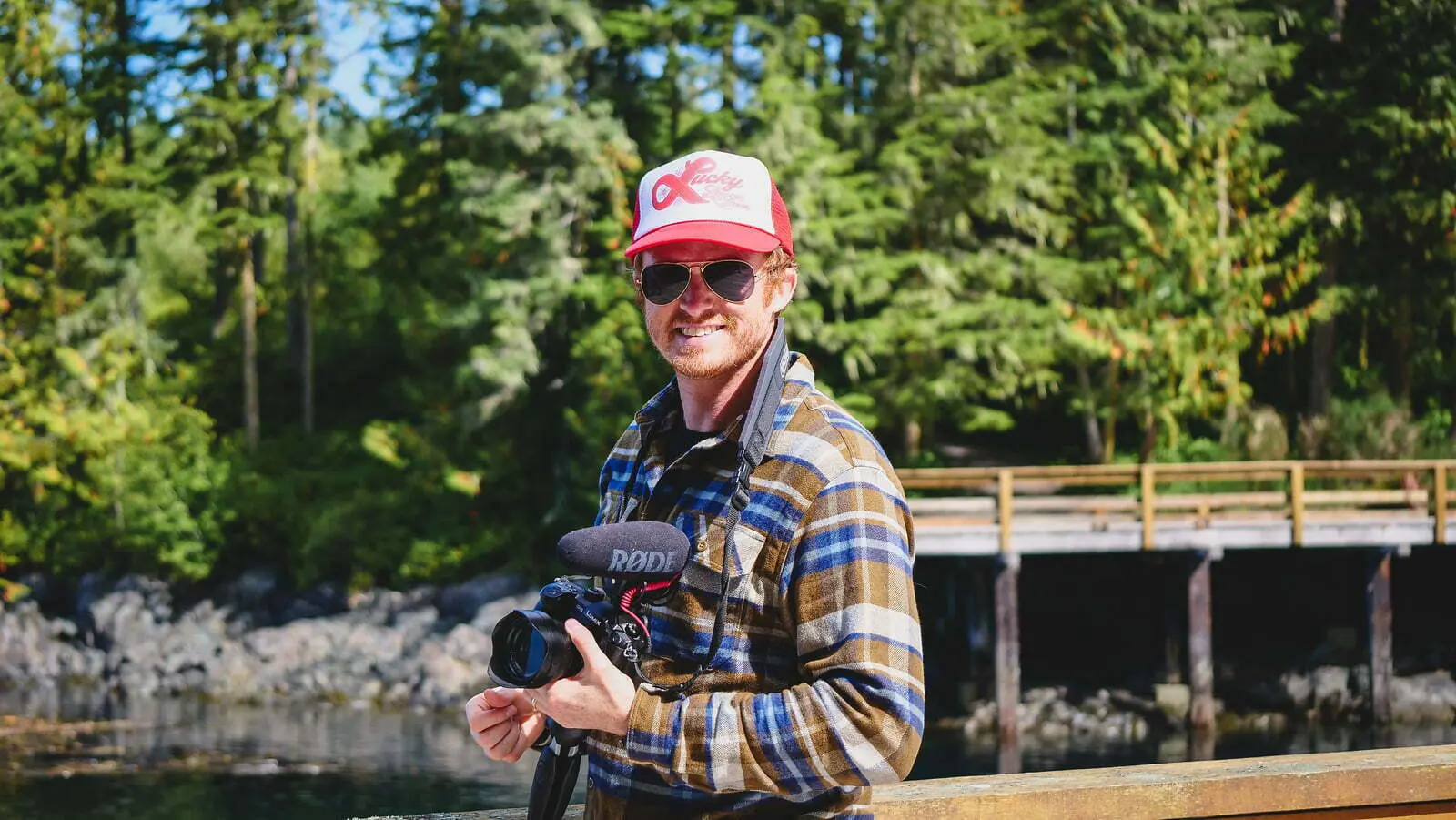 Nomadic Samuel filming travel videos while visiting Telegraph Cove, British Columbia, Canada