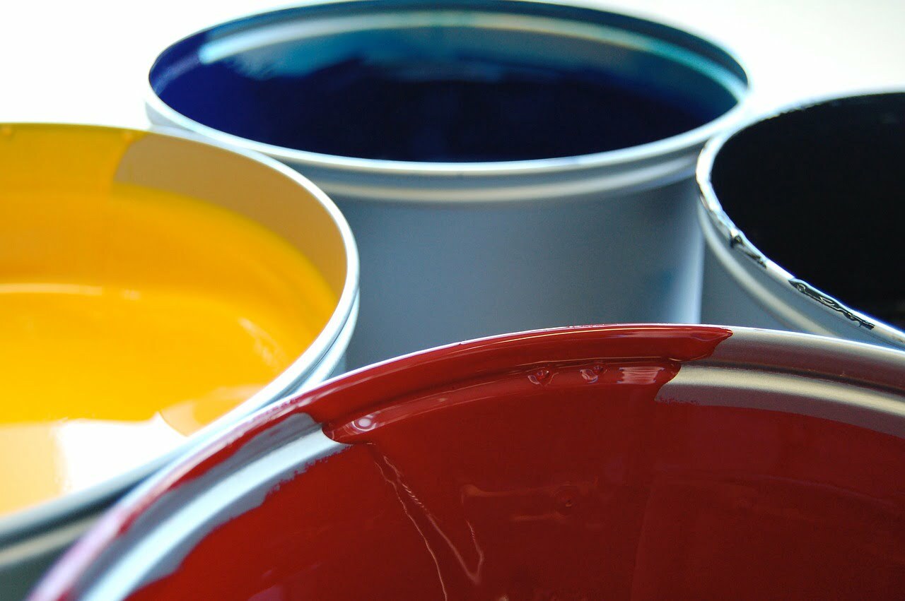 Four buckets of paint 