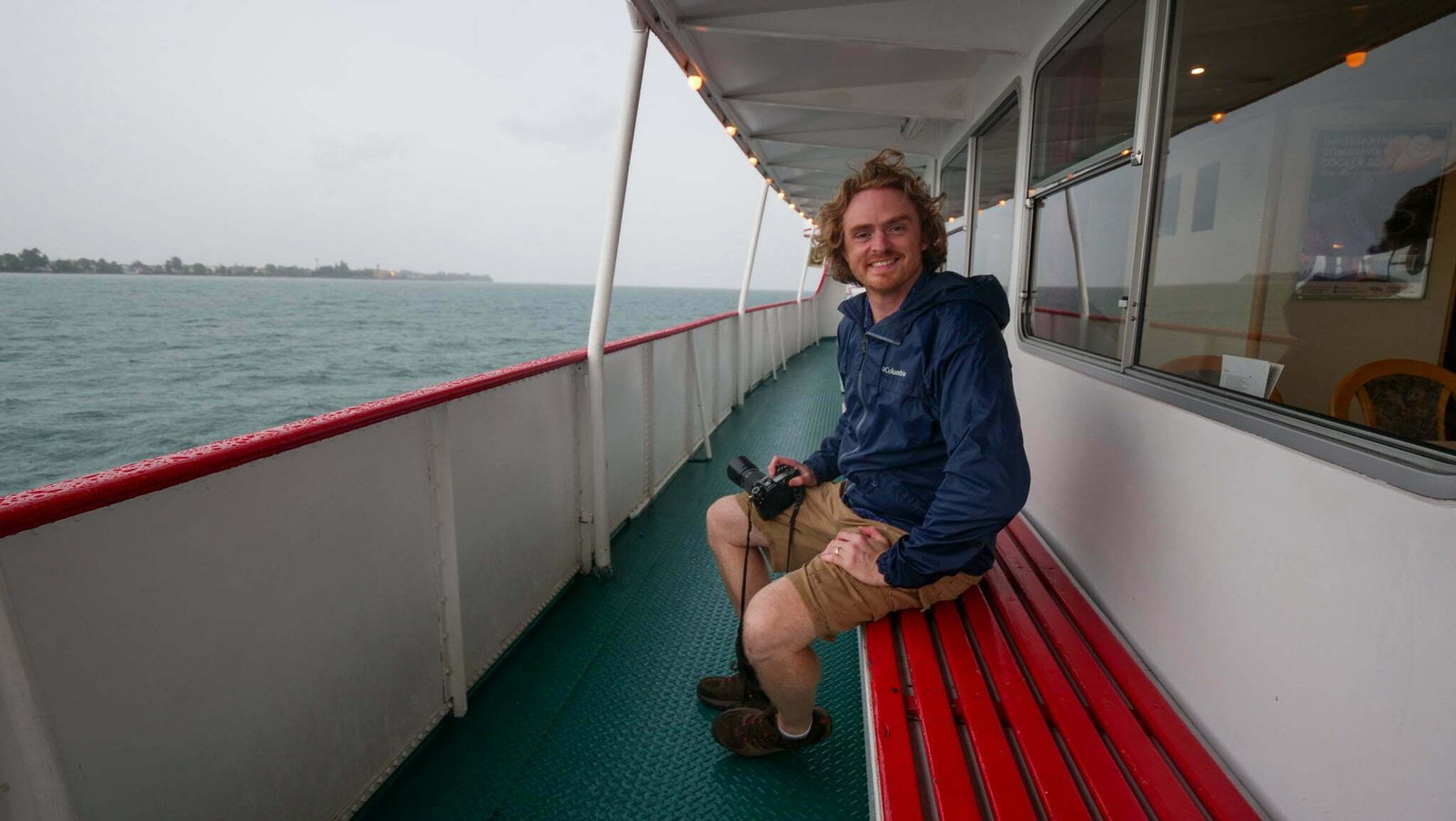 Nomadic Samuel visiting Lake Constance via ferry in Germany on a very rainy and windy day 