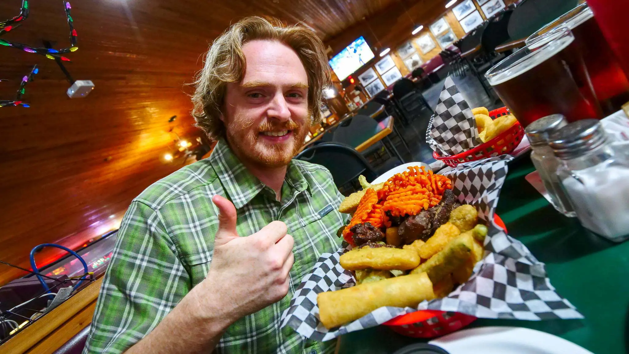 Nomadic Samuel feasting on pub food in Alberta, Canada
