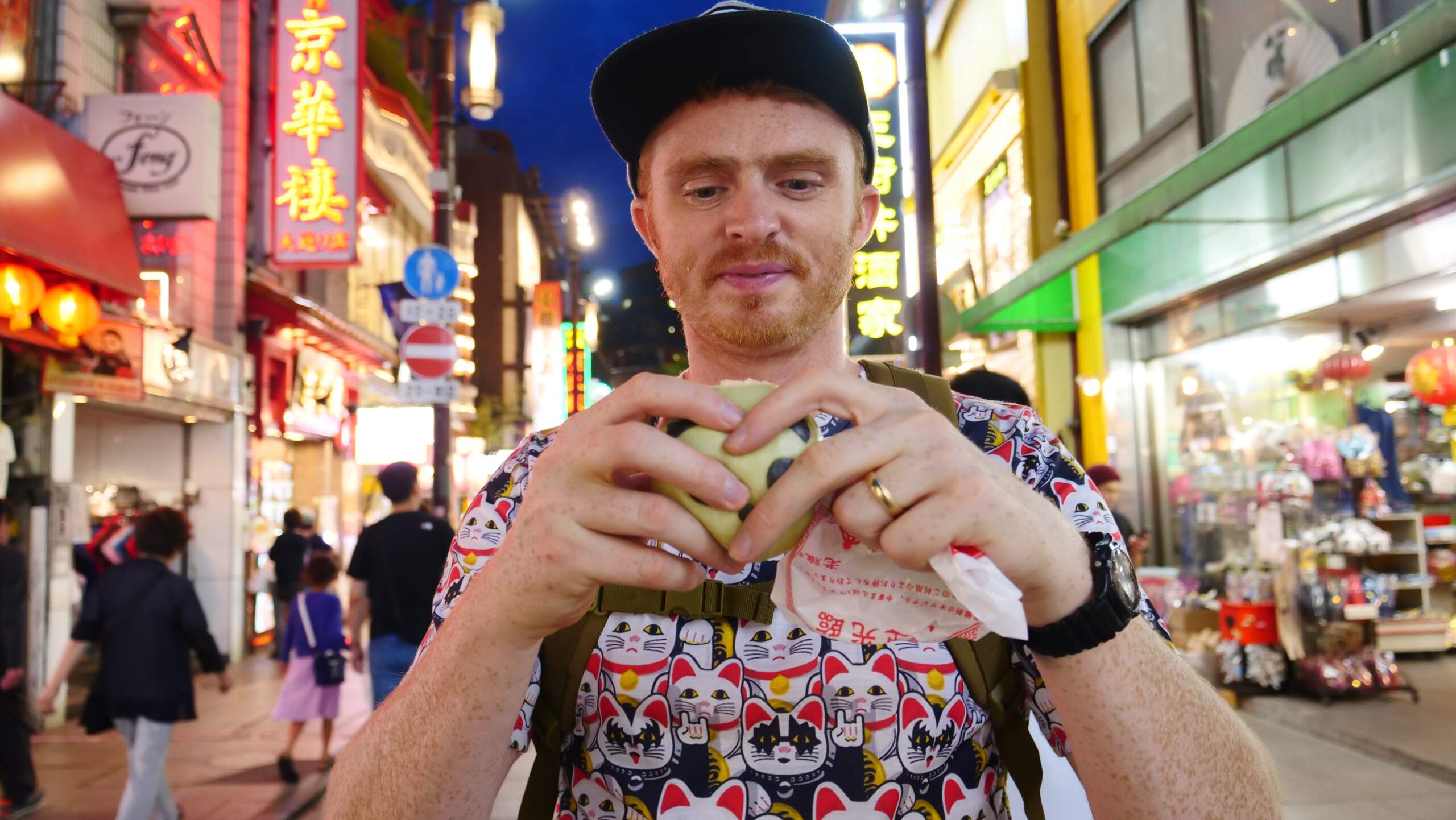 Nomadic Samuel eating street food in Tokyo, Japan