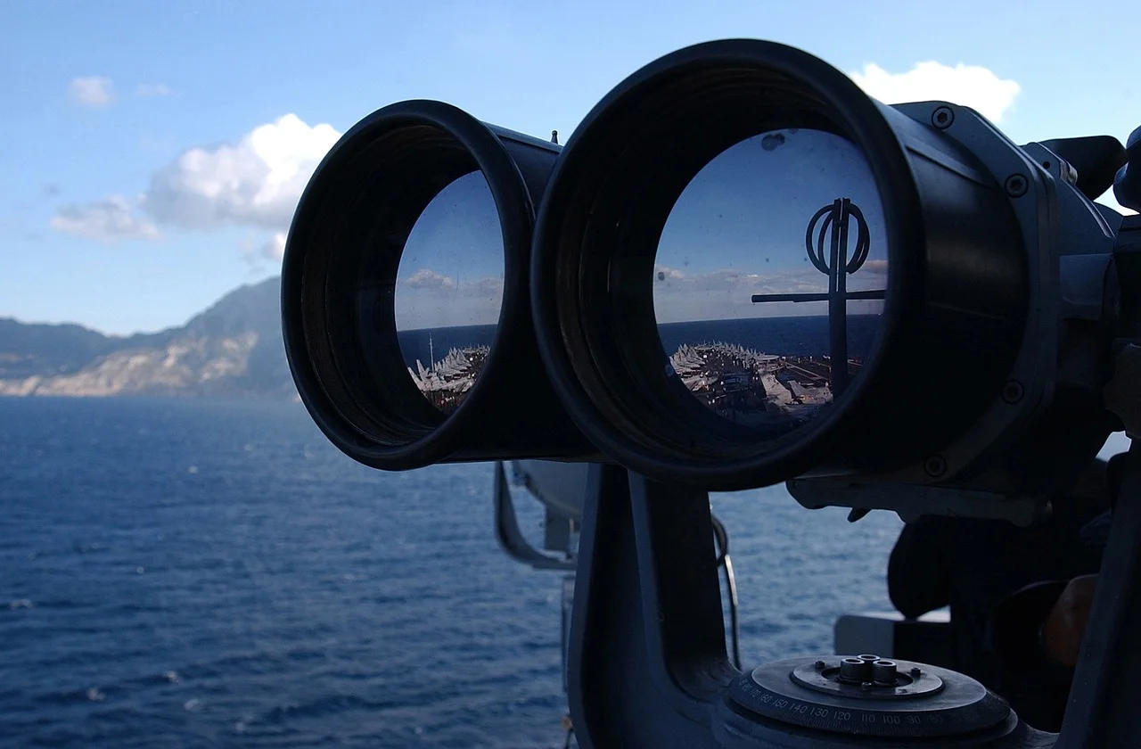 Strategy Behind The Fund Featuring Mark Neuman Covering Constrained Capital ESG Orphans ETF ORFN navy binoculars 
